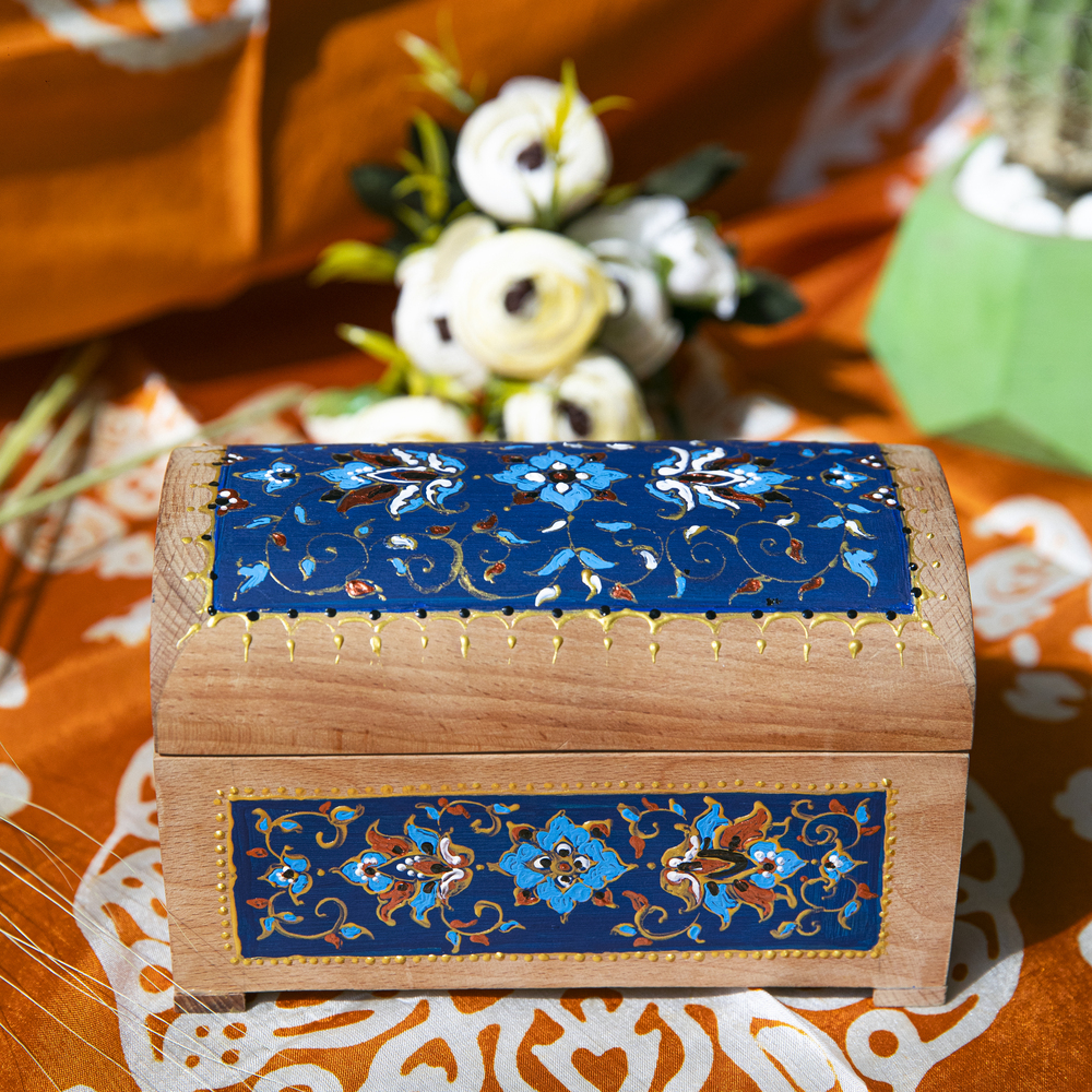 Wooden gift box with blue patterns. High quality photo